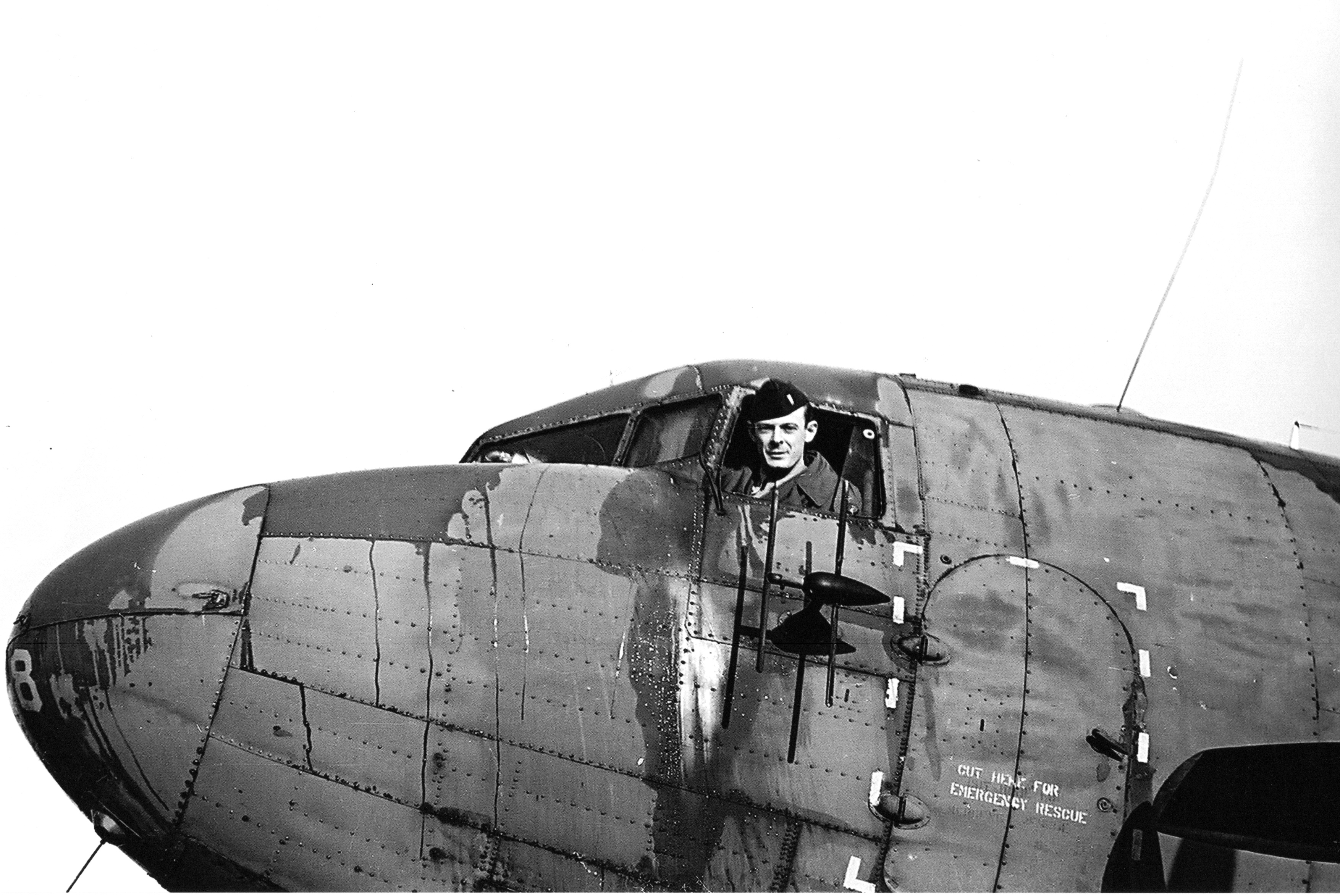 George Ethridge Jr. in the cockpit of a plane.
