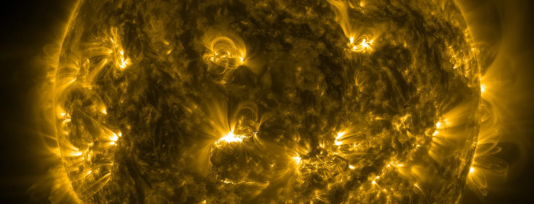 A picture of the sun with brilliant yellow flares coming off its globe-like shape.