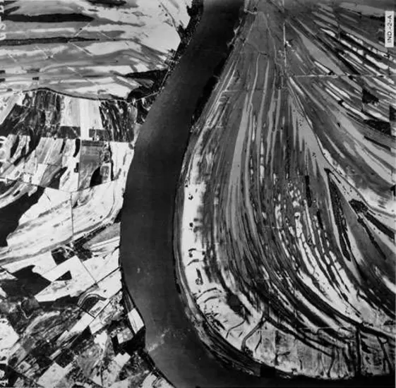 An aerial photo of a river winding through land on either side.