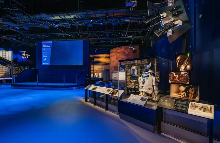 Space exhibition bathed in blue light